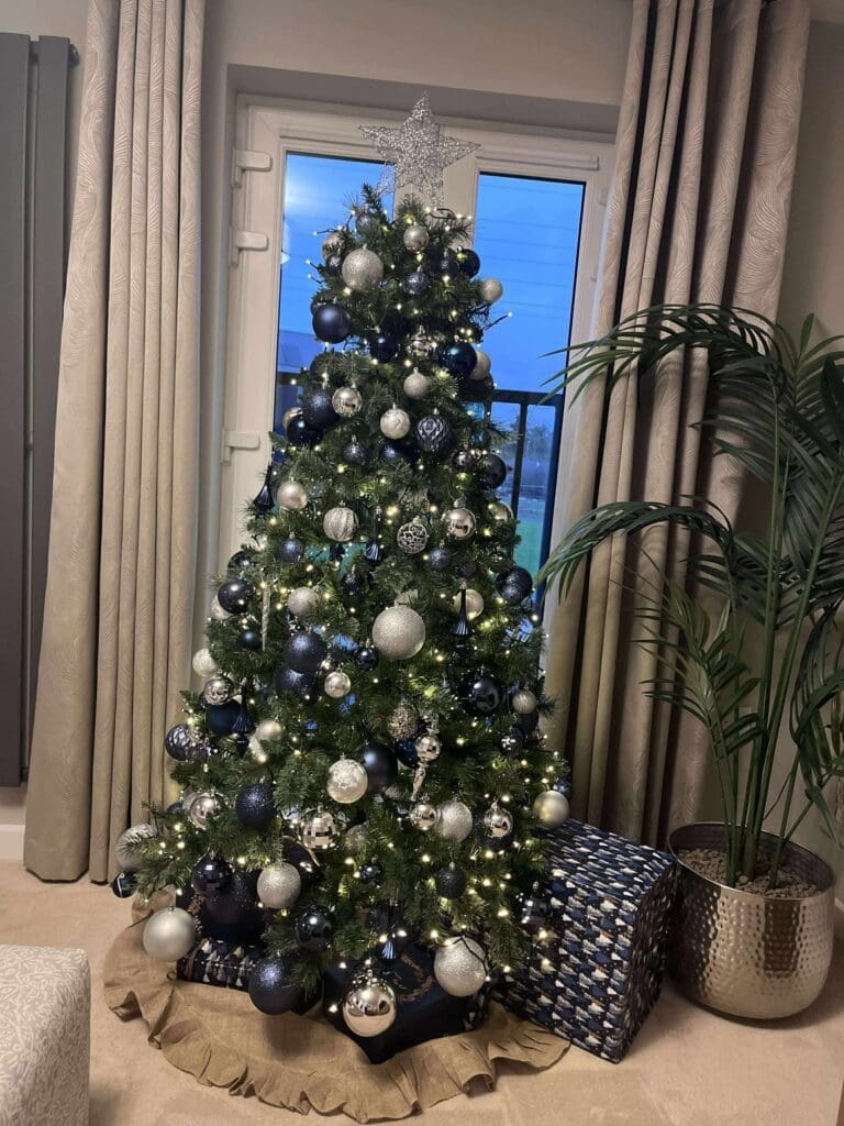 Navy and silver Christmas tree in a home lounge, Worcestershire