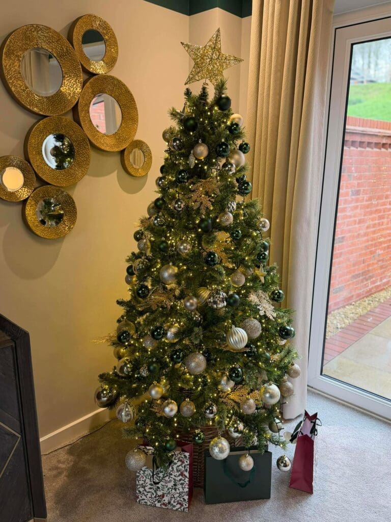 Gold and cream Christmas tree decoration in a home, Worcestershire