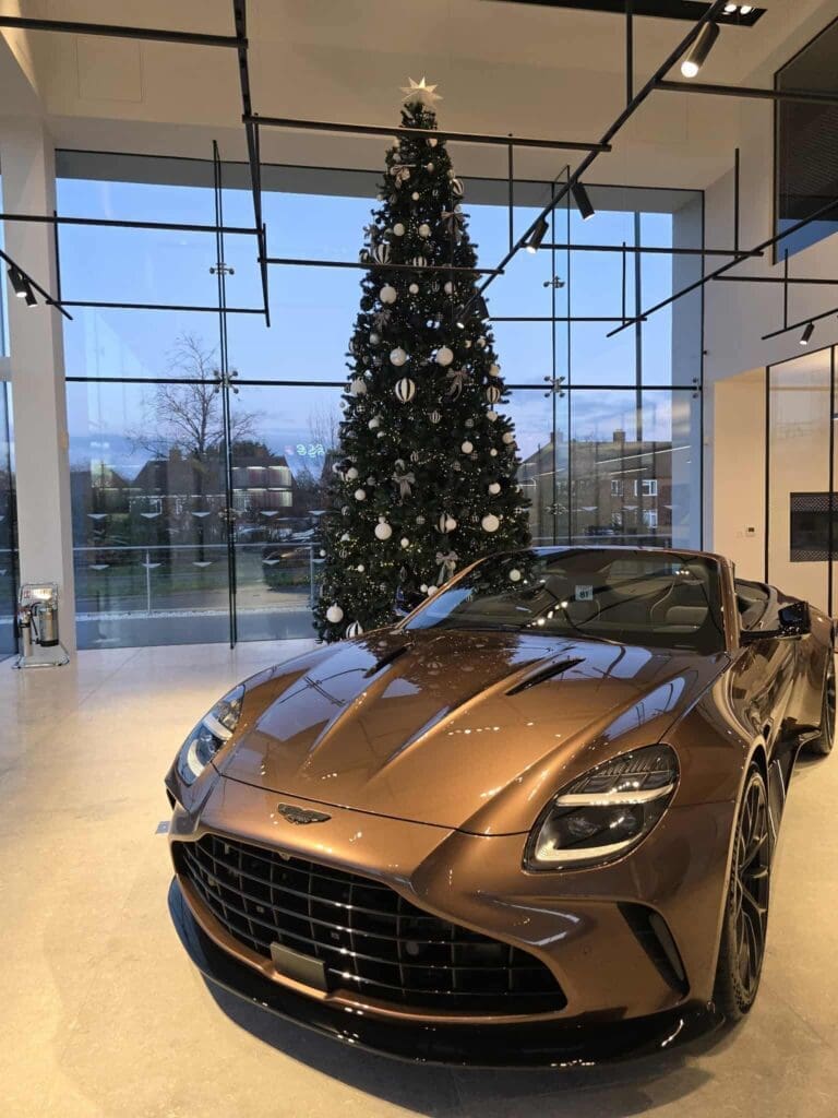 Christmas tree installation in Aston Martin car showroom, West Midlands
