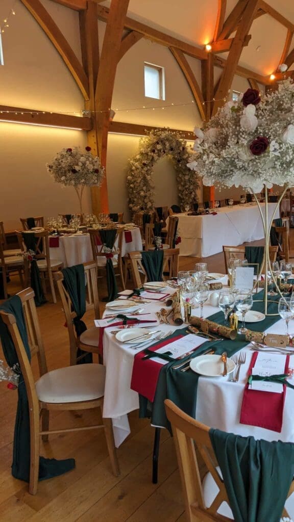 Festive gala dinner table styling in a timber barn venue